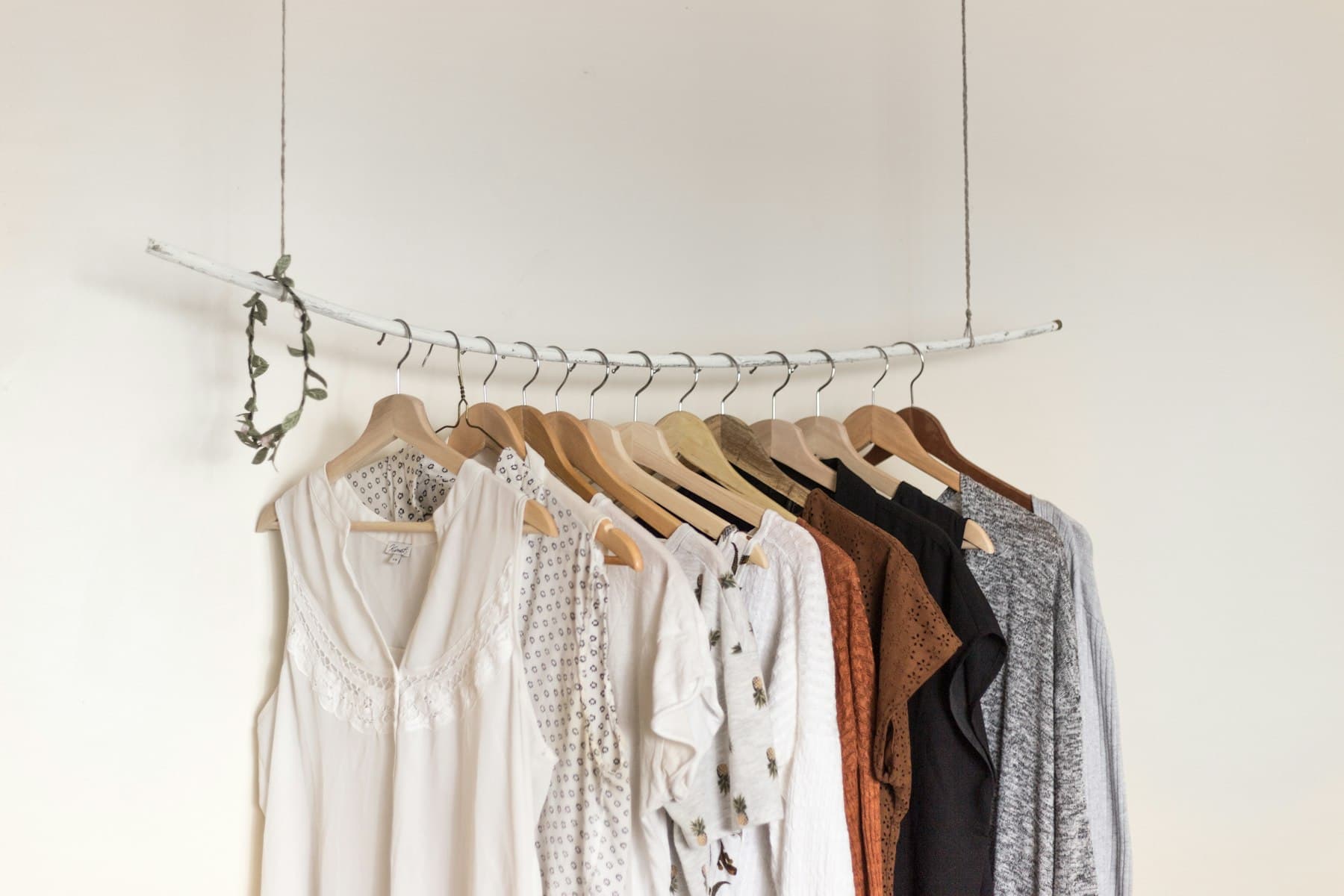 Editorial fashion scene with neutral wardrobe pieces and seasonal styling